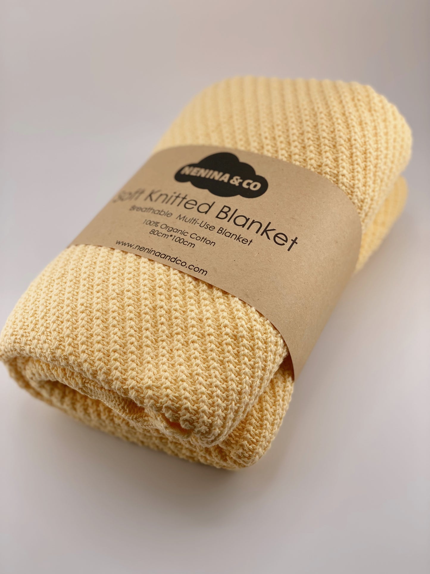 
                  
                    Cobertor de malha mostarda 100% algodão orgânico Nenina &amp; Co
                  
                